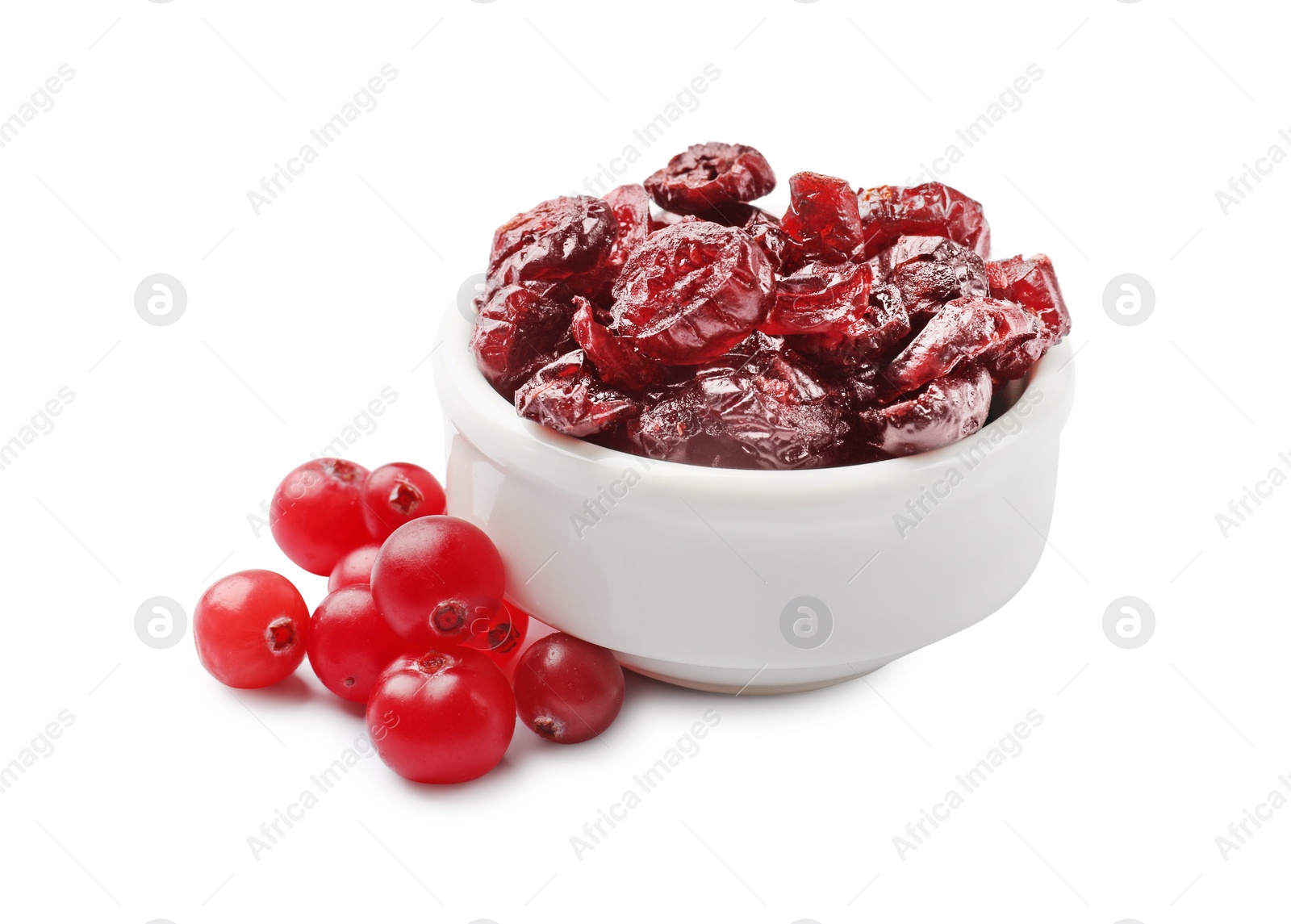 Photo of Dried cranberries in bowl and fresh berries on white background