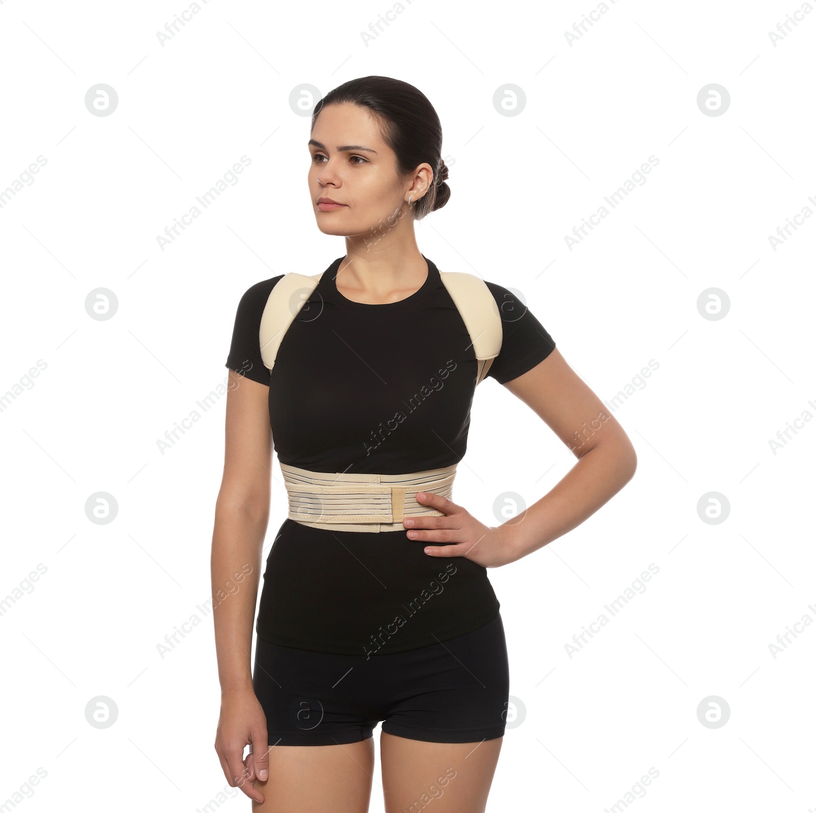 Photo of Beautiful woman with orthopedic corset on white background