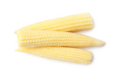 Photo of Tasty fresh baby corns isolated on white, top view