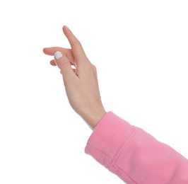 Woman holding something on white background, closeup of hand