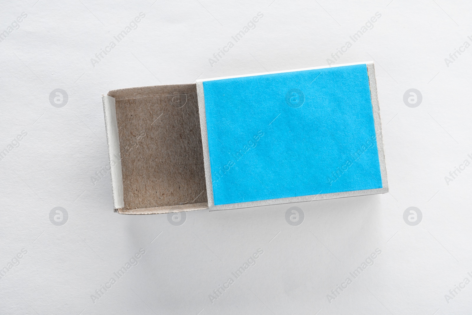 Photo of Empty matchbox on white background, top view. Space for design