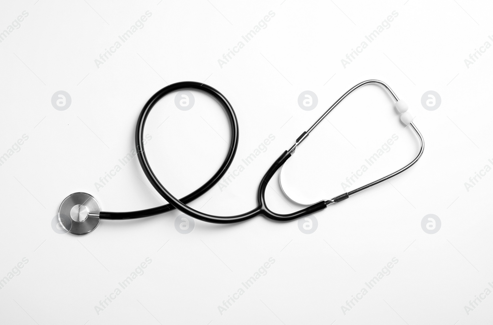 Photo of Stethoscope isolated on white, top view. Medical tool