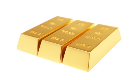 Photo of Precious shiny gold bars on white background