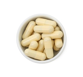 Photo of Vitamin capsules in bowl isolated on white, top view. Health supplement