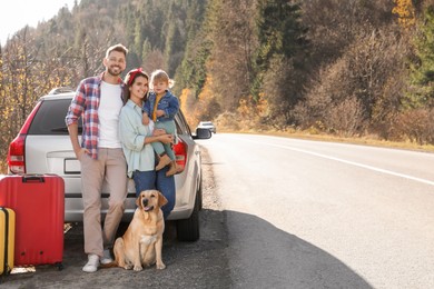 Parents, their daughter and dog near car outdoors, space for text. Family traveling with pet