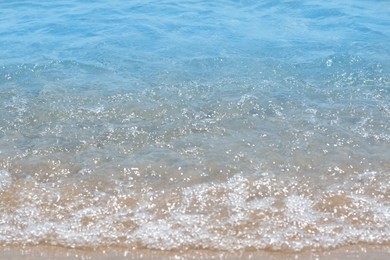 Photo of Beautiful view of sea wave on sandy shore