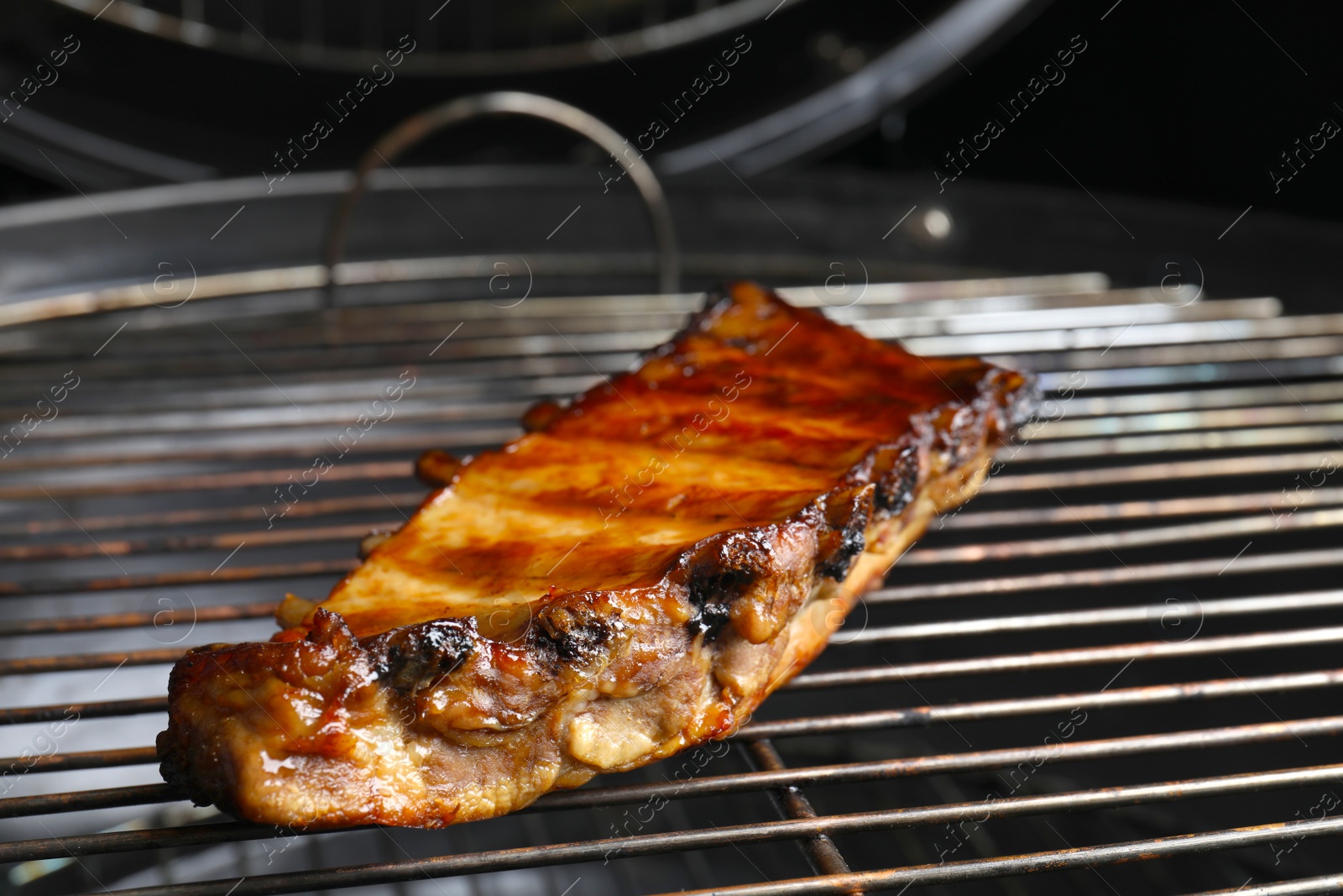 Photo of Delicious ribs on barbecue grill. Yummy meat