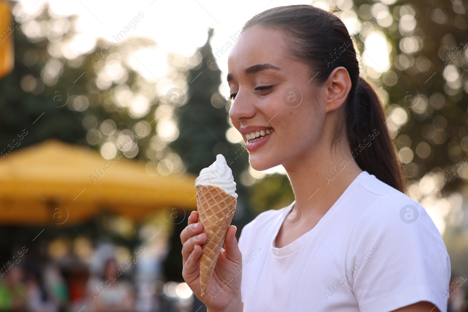 Photo of Lviv, Ukraine - September 26, 2023: Woman with McDonald's ice cream outdoors, space for text