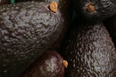 Delicious ripe avocadoes as background closeup view