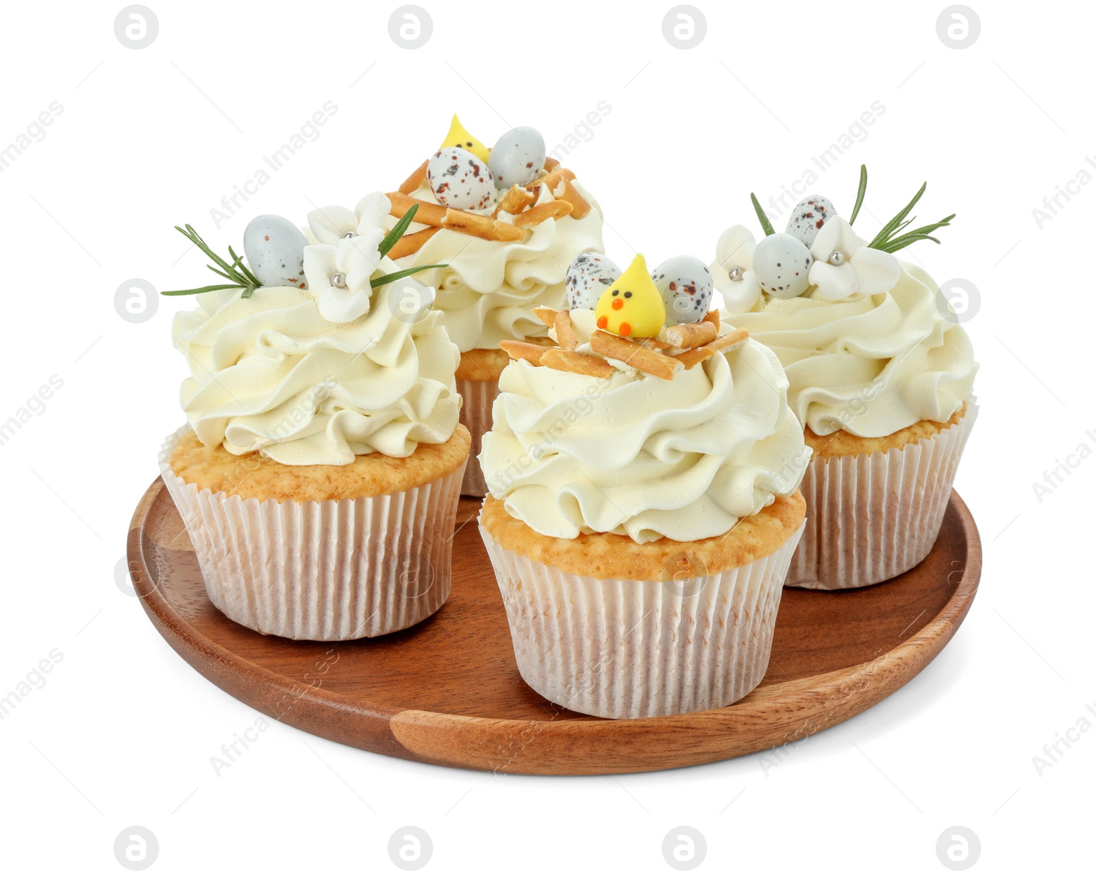 Photo of Tasty Easter cupcakes with vanilla cream isolated on white