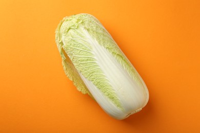 Photo of Fresh ripe Chinese cabbage on orange background, top view