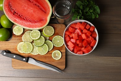 Fresh ingredients for making watermelon drink with lime on wooden table, above view