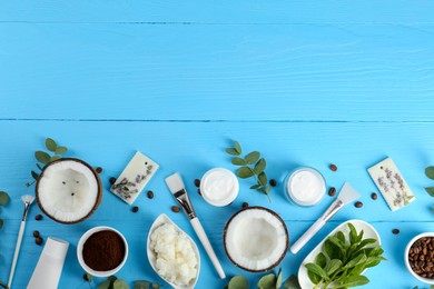 Photo of Flat lay composition with homemade cosmetic products and fresh ingredients on light blue wooden table. Space for text