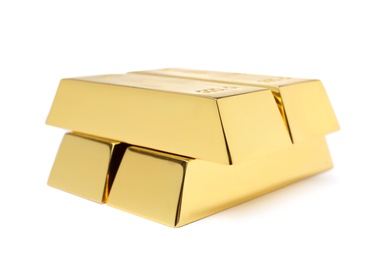 Photo of Precious shiny gold bars on white background