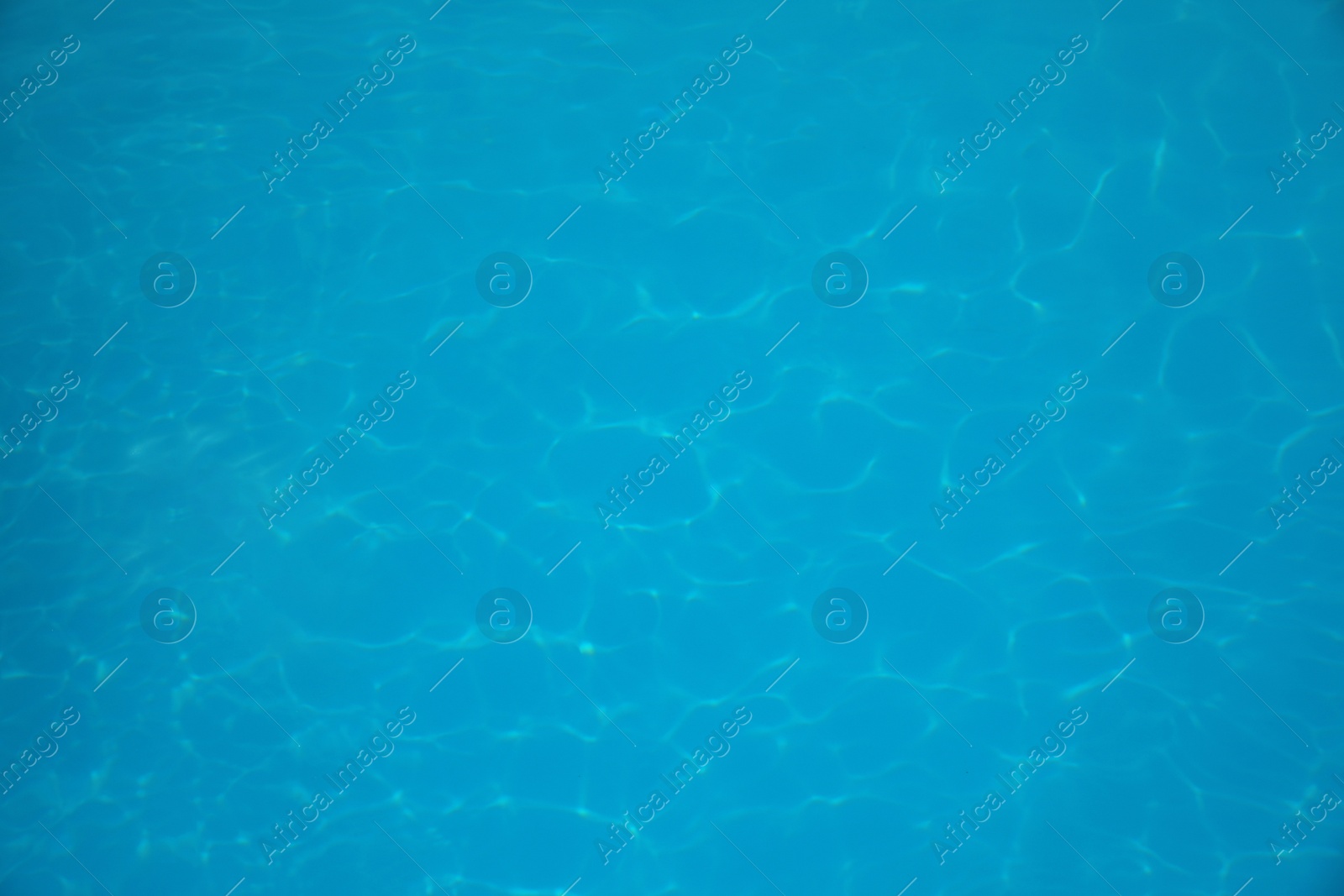 Photo of Surface of swimming pool with clean blue water as background