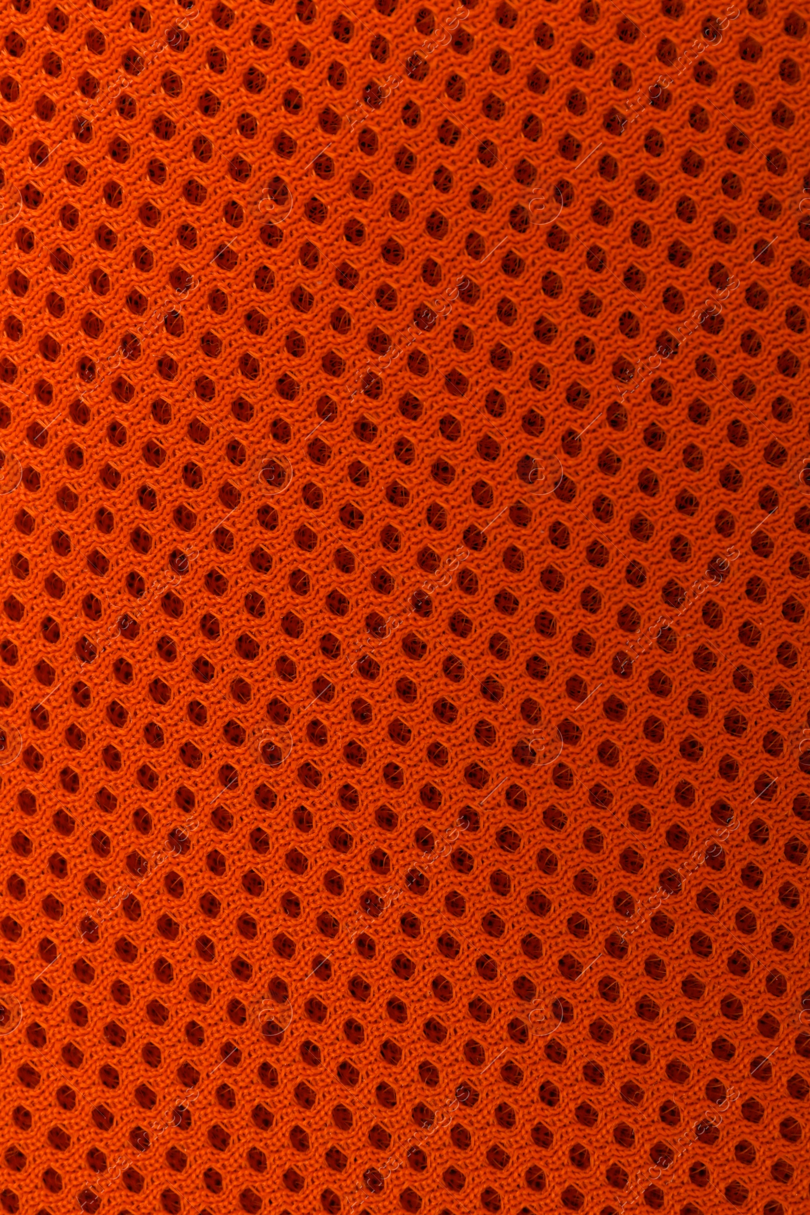 Photo of Texture of orange fabric as background, top view