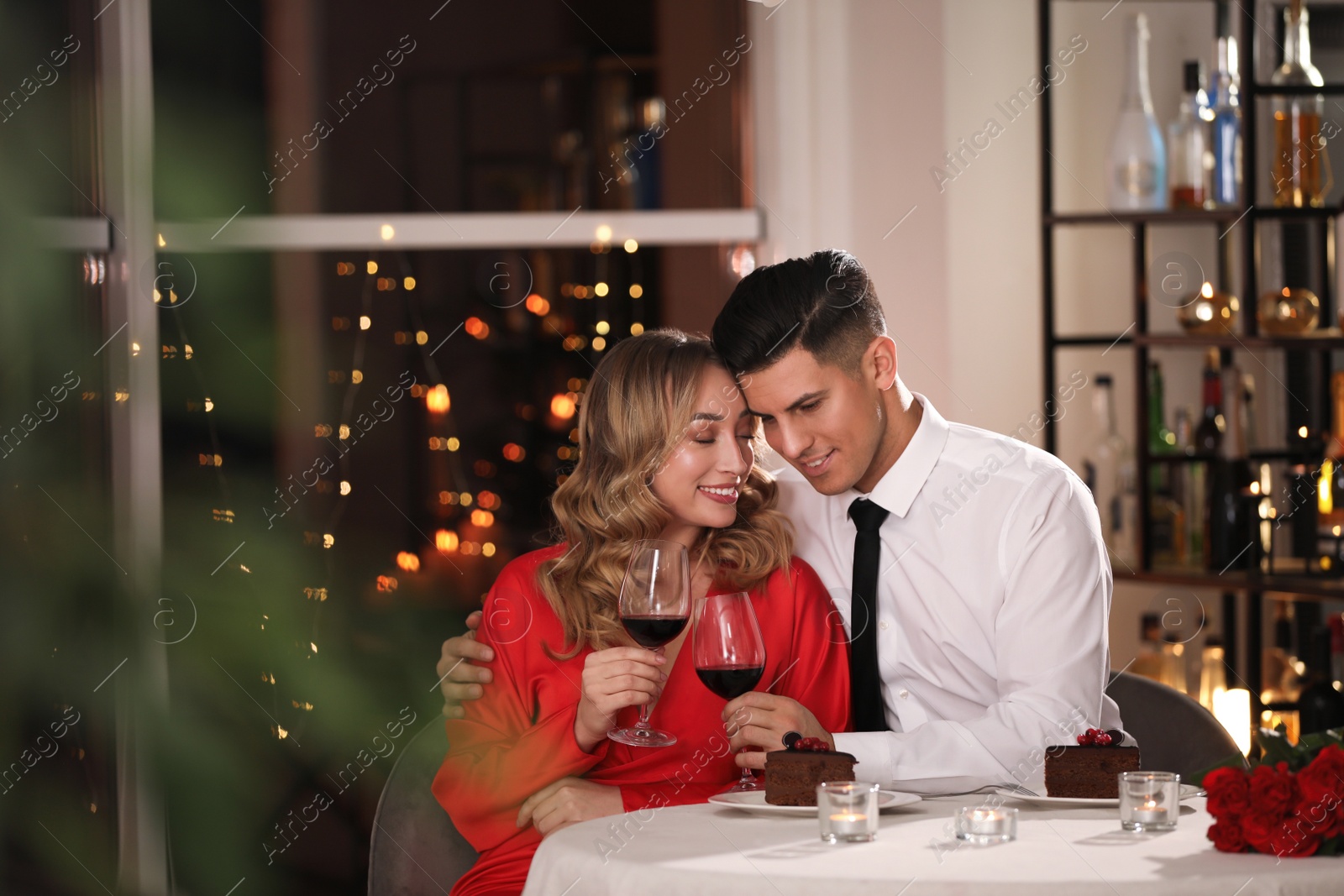 Photo of Lovely couple having romantic dinner on Valentine's day in restaurant