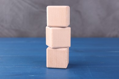 International Organization for Standardization. Cubes with abbreviation ISO on blue wooden table