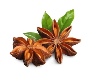 Image of Aromatic dry anise stars and green leaves on white background