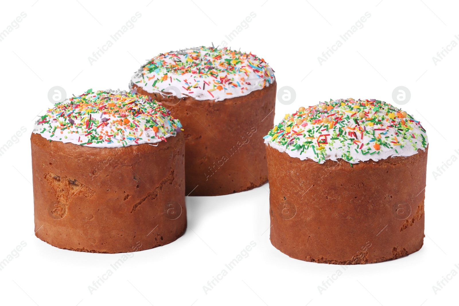 Photo of Traditional Easter cakes with sprinkles isolated on white