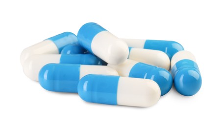 Pile of antibiotic pills isolated on white