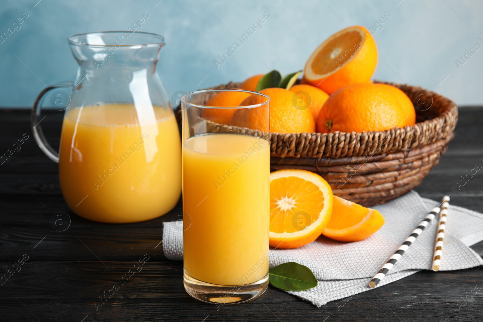 Photo of Composition with orange juice and fresh fruit on table