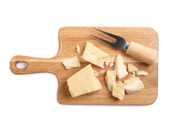 Photo of Parmesan cheese with fork and wooden board on white background, top view
