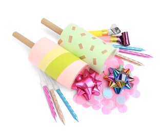 Photo of Party crackers and different festive items on white background, above view