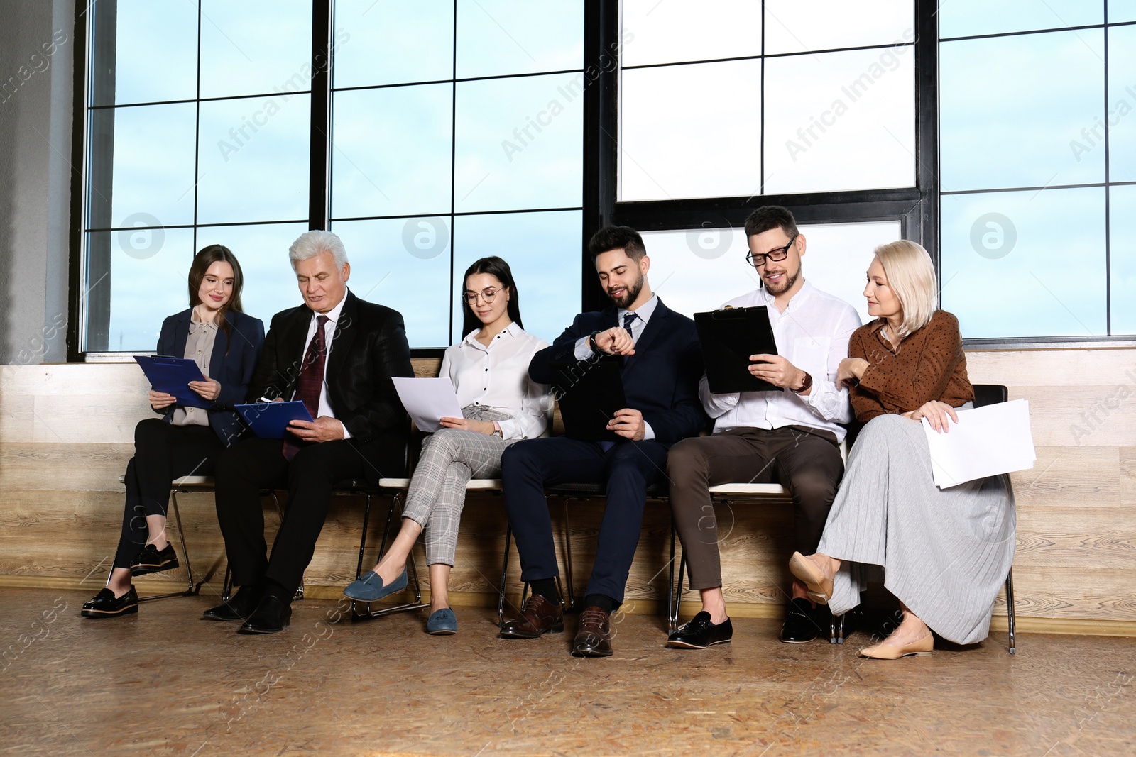 Photo of People waiting for job interview in office hall