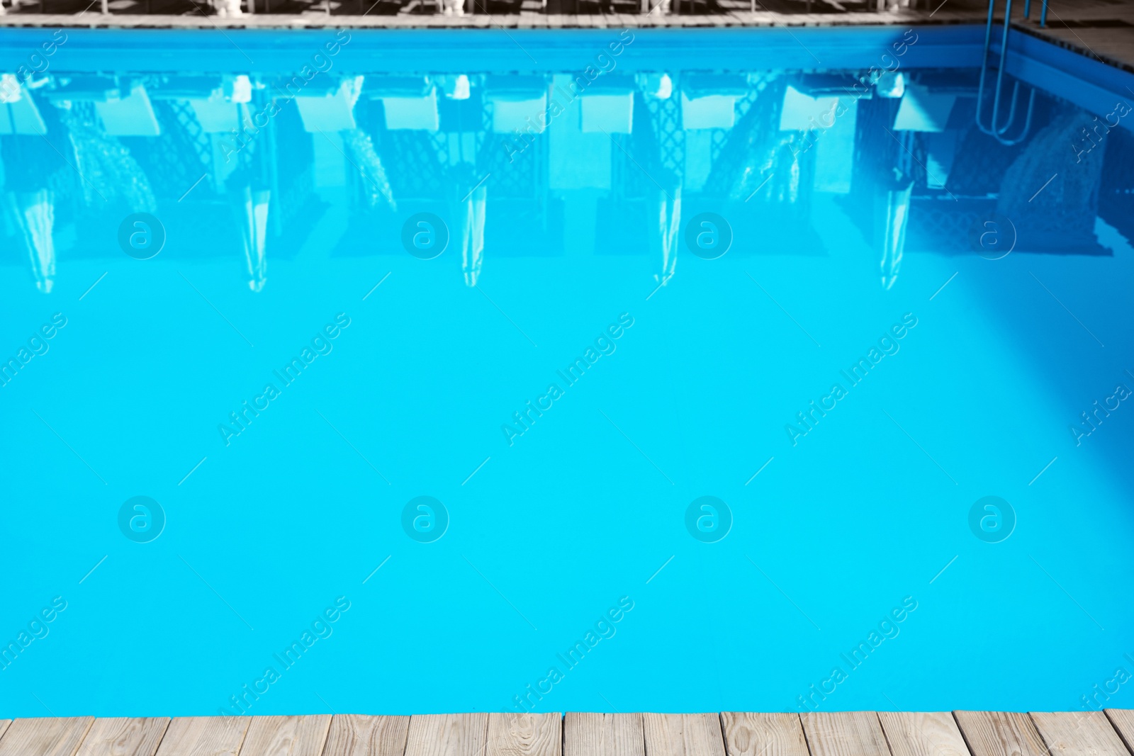 Photo of Refreshing blue water in swimming pool outdoors