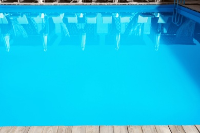 Photo of Refreshing blue water in swimming pool outdoors