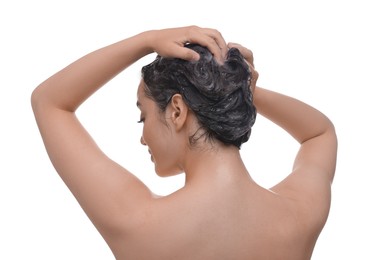 Photo of Woman washing hair on white background, back view