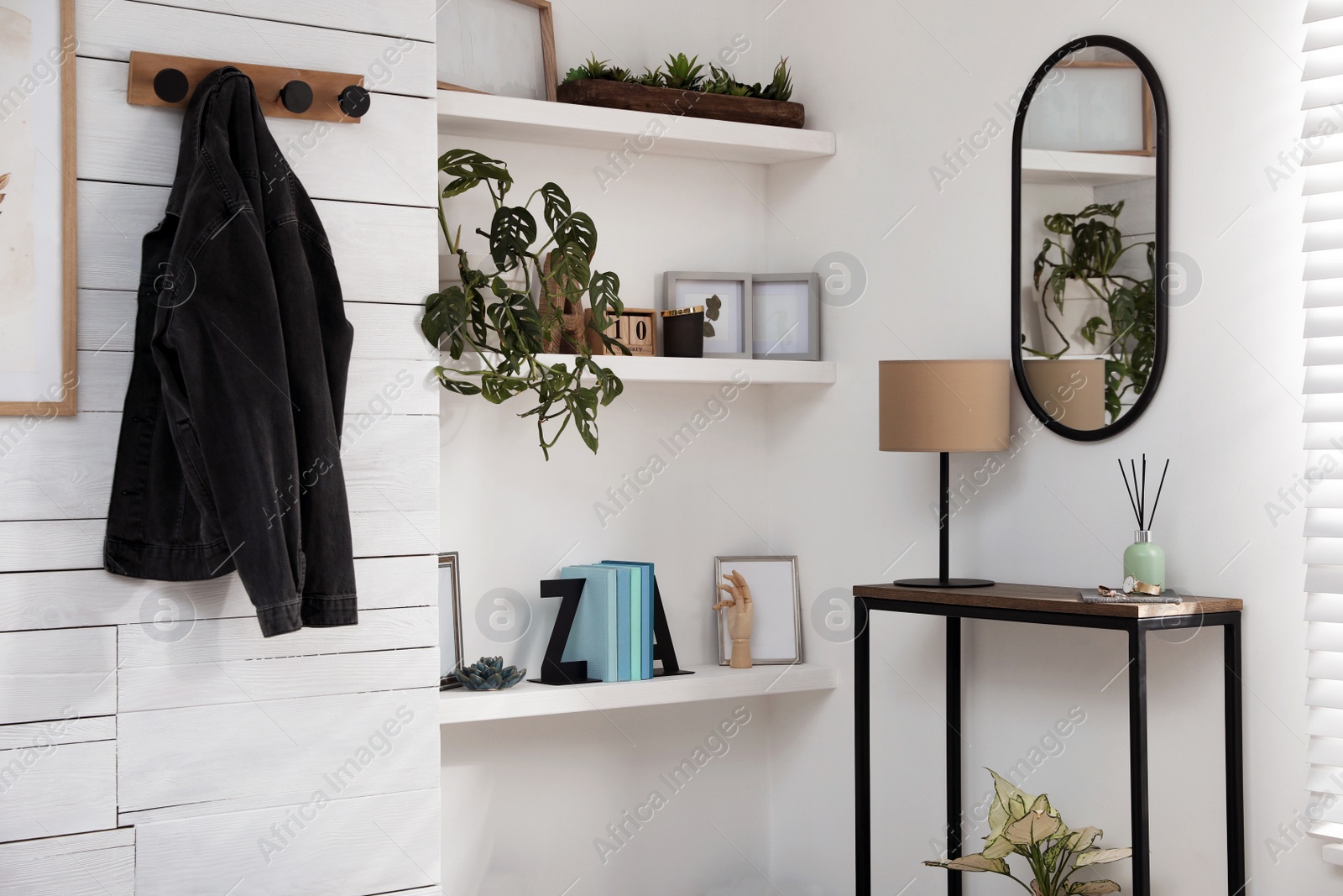 Photo of Hallway interior with console table and stylish decor