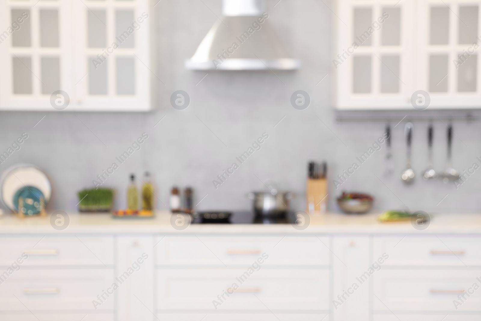 Photo of Blurred view of modern kitchen. Interior design