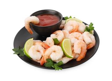 Photo of Tasty boiled shrimps with cocktail sauce, lime and parsley isolated on white