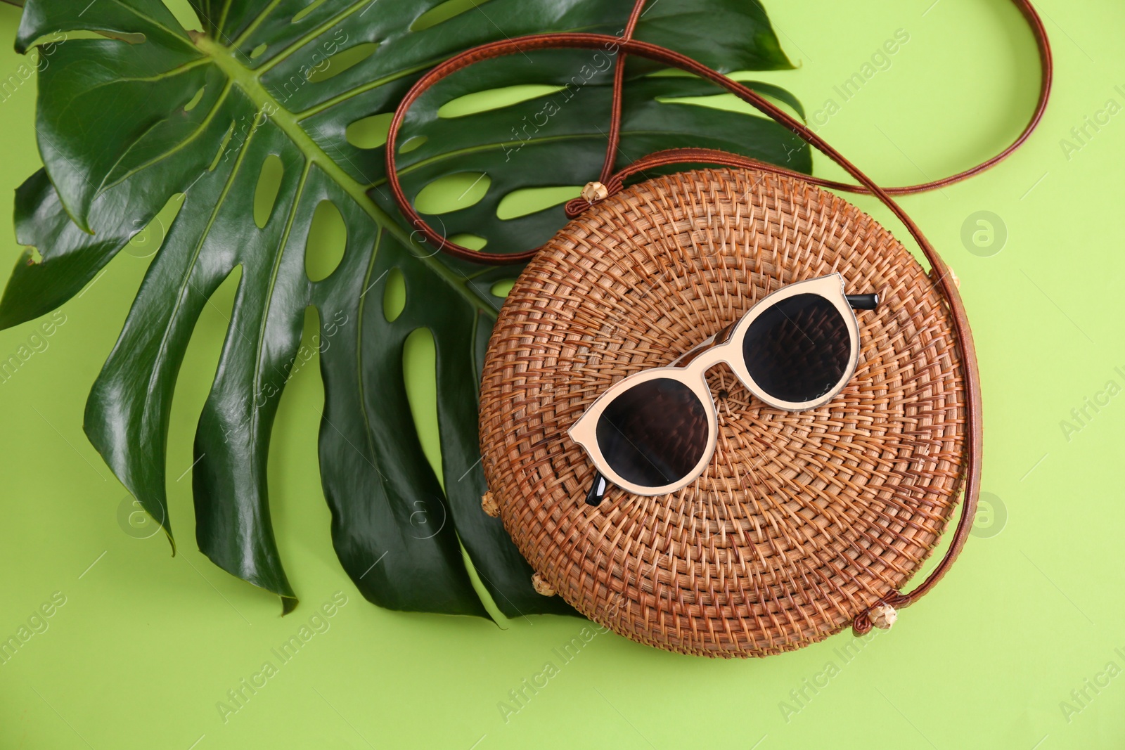 Photo of Flat lay composition with bamboo bag on color background