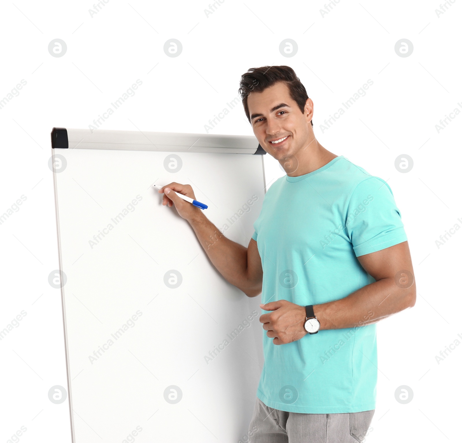 Photo of Professional business trainer near flip chart on white background