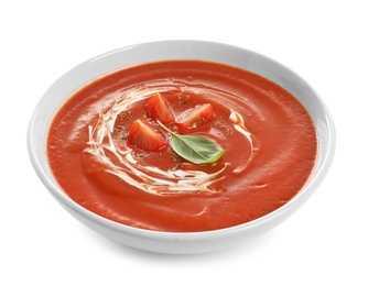 Dish with tomato cream soup on white background. Healthy food