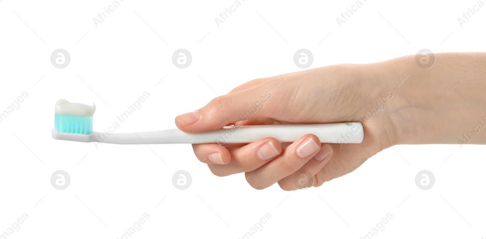 Photo of Woman holding toothbrush with paste on white background, closeup