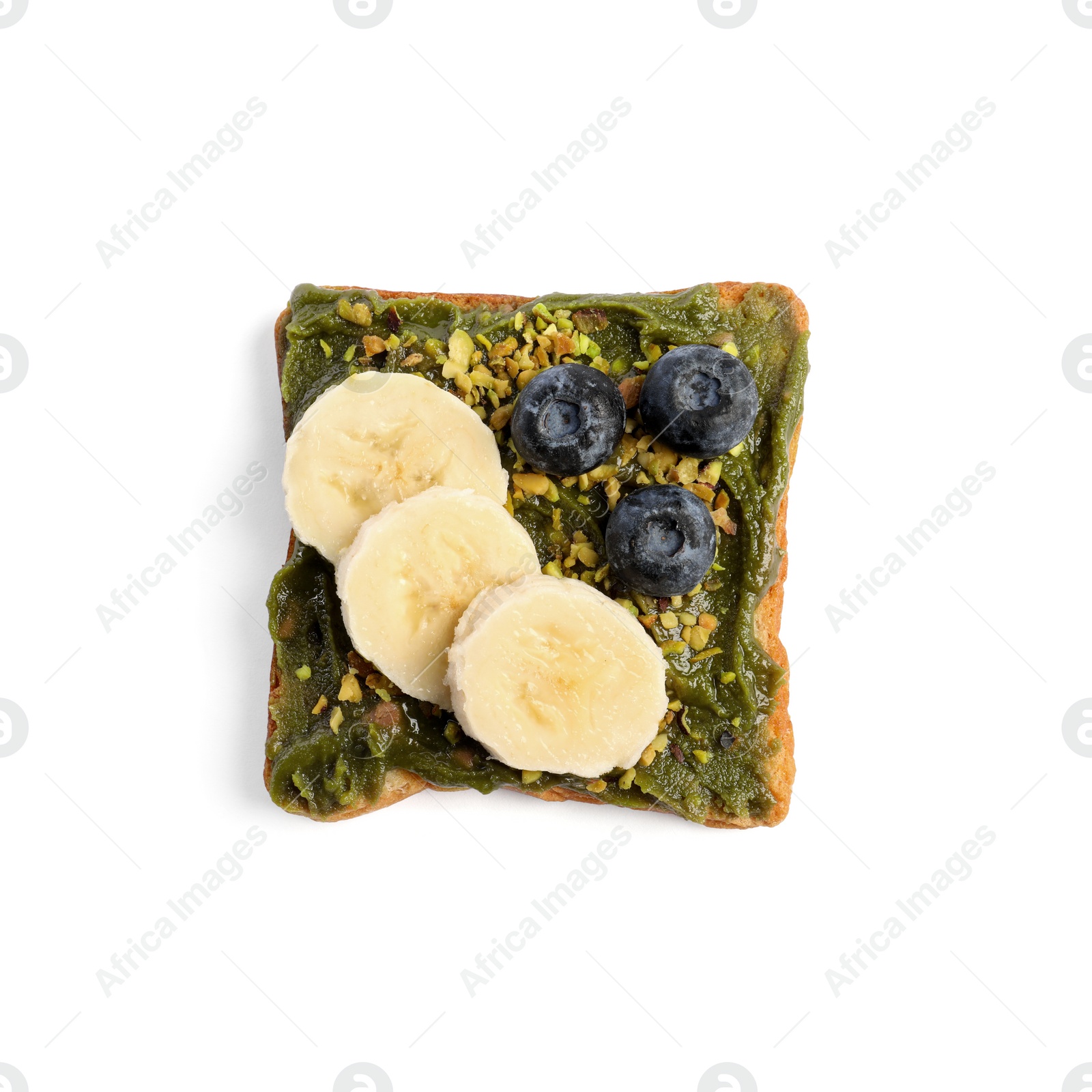 Photo of Toast with tasty pistachio butter, banana slices, blueberries and nuts isolated on white, top view