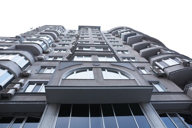 Photo of Modern office building with tinted windows against sky