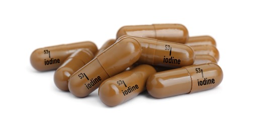 Photo of Pile of iodine pills isolated on white