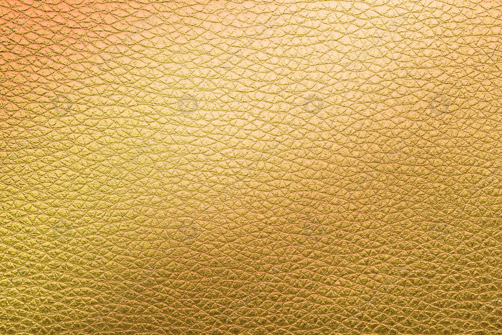 Image of Golden textured surface as background, closeup view