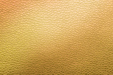 Image of Golden textured surface as background, closeup view