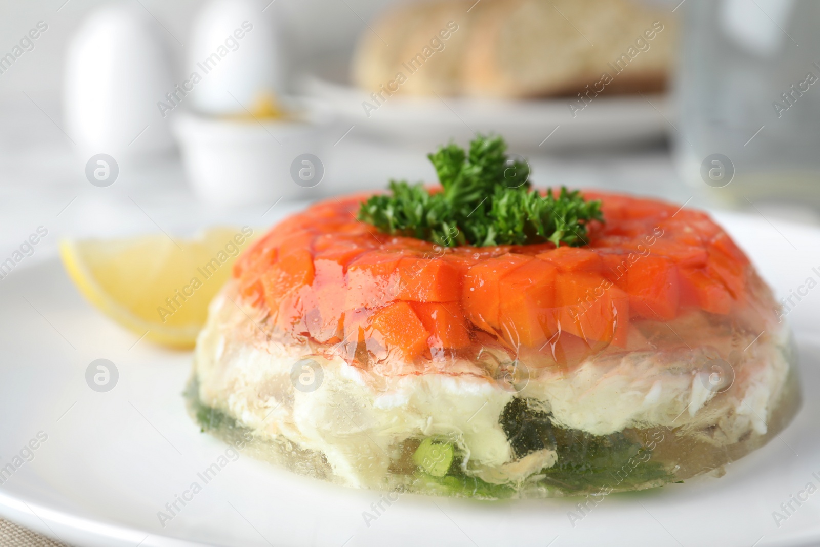 Photo of Delicious fish aspic with parsley on plate, closeup