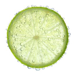 Fresh lime slice in sparkling water on white background