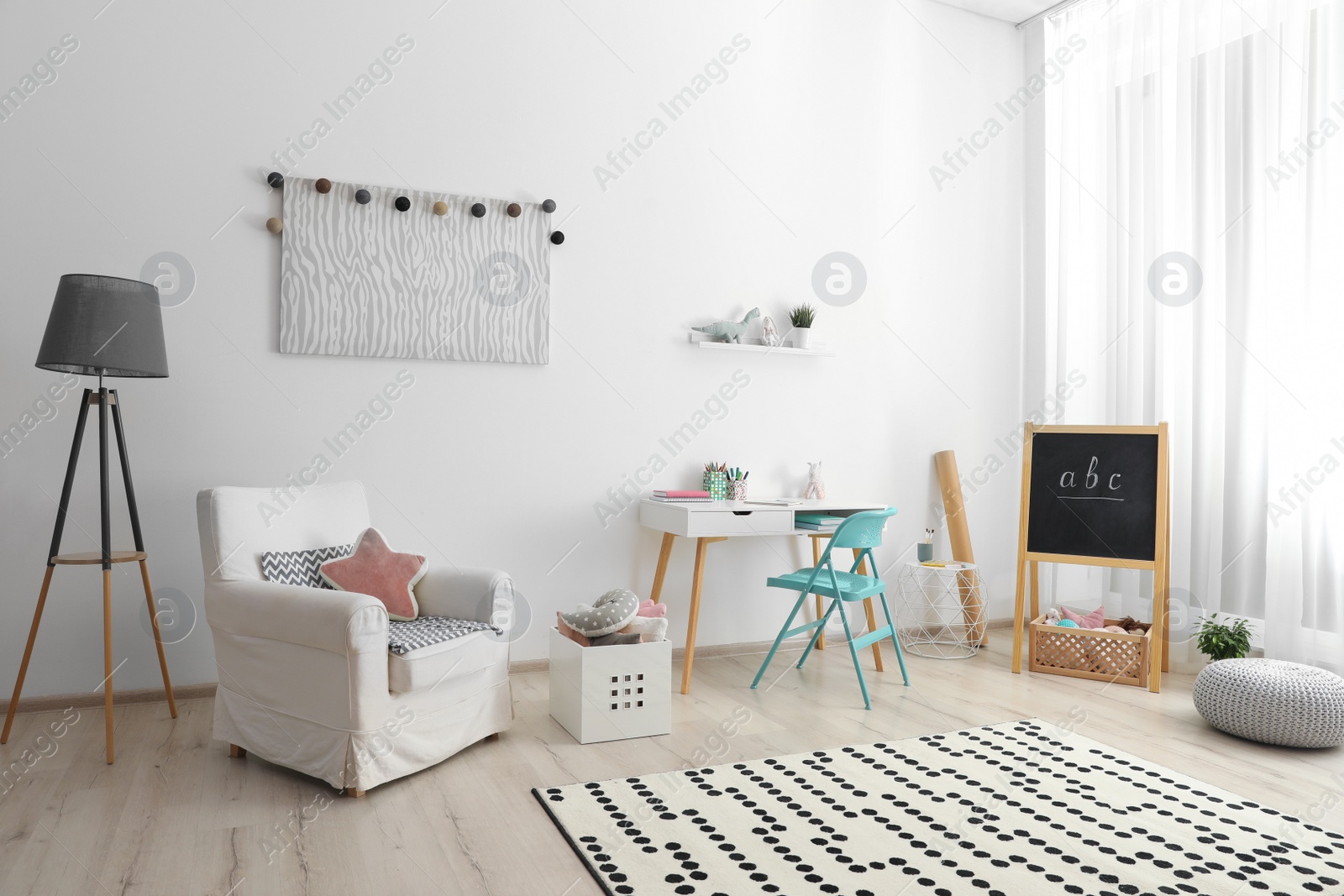 Photo of Modern child room interior with stylish furniture