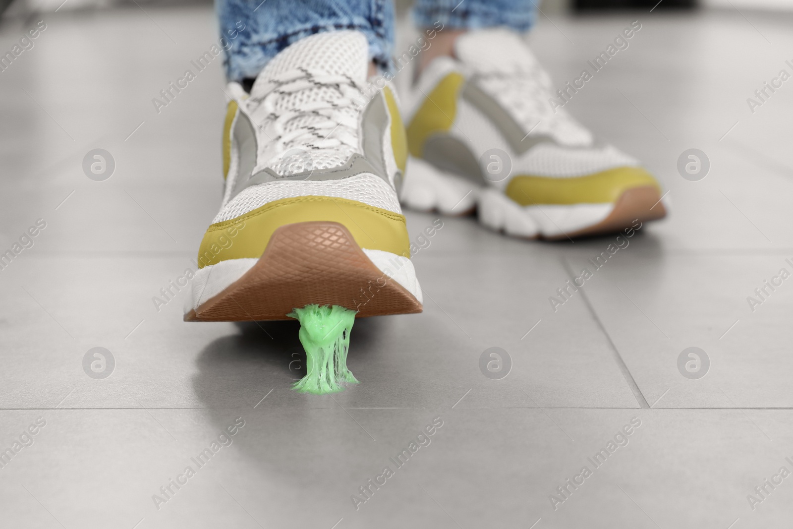 Photo of Person stepping into chewing gum on floor, closeup