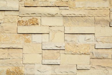 Texture of beige brick wall as background