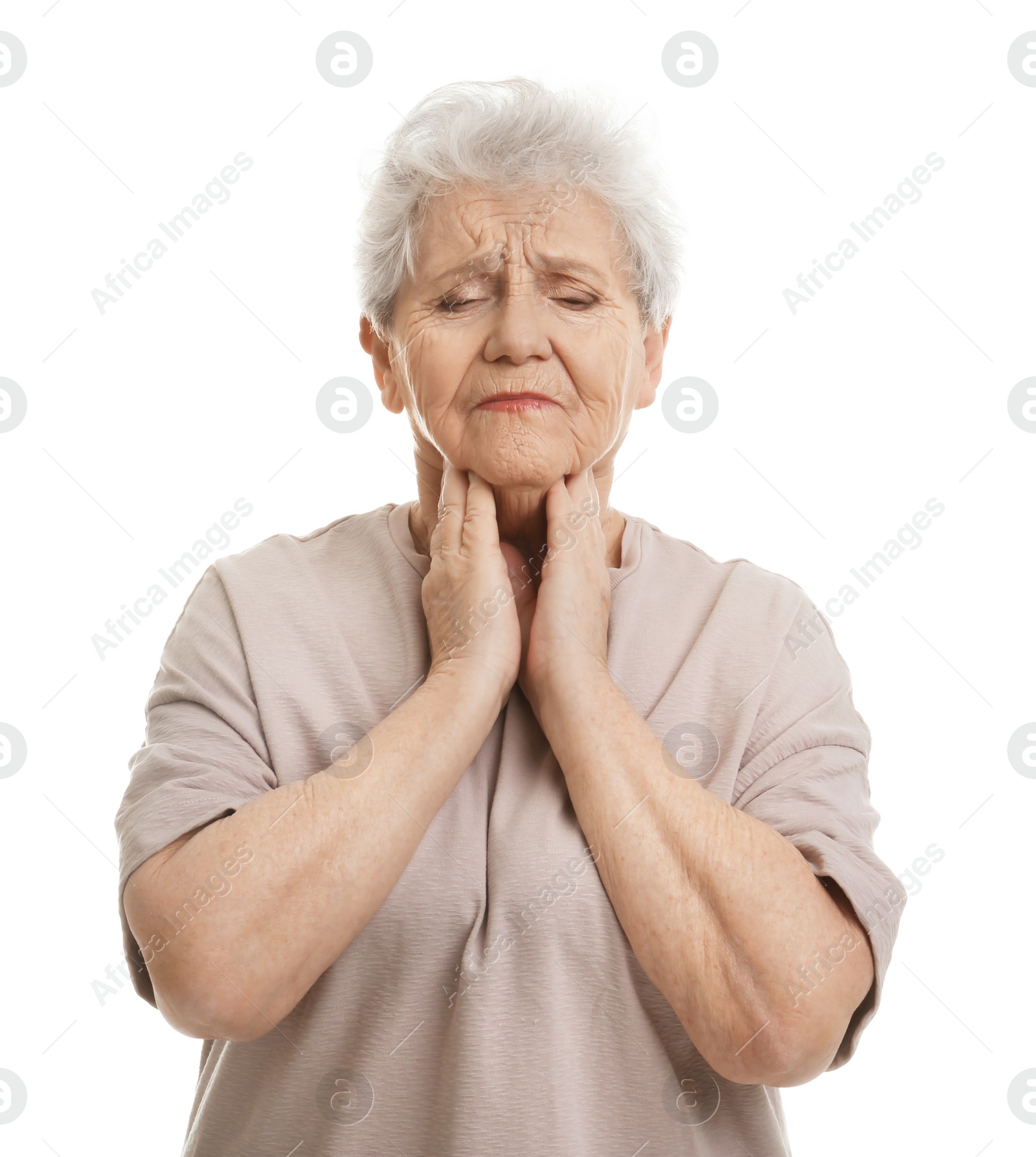 Photo of Elderly woman suffering from sore throat on white background